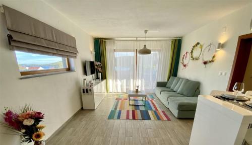 a living room with a couch and a table at Apartments by the sea Ist - 22436 in Ist