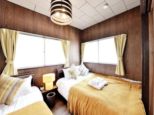Open Sale! Umeda 3 min away 2BR Max6 Free tour guideにあるベッド