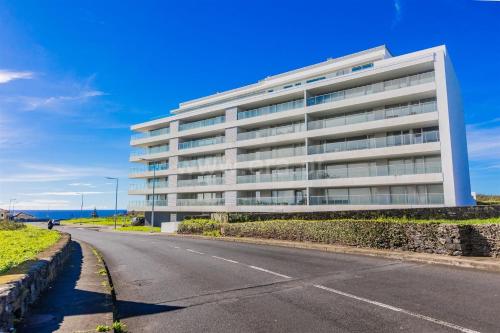 an empty road in front of a building at Atlantic Golden View Luxe Apartment in Ponta Delgada