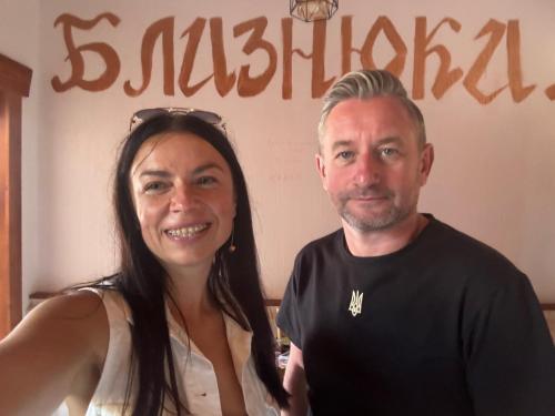 a man and a woman posing for a picture at Готель TWINS РАЙ in Vorokhta