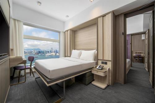 Motto by Hilton Hong Kong Sohoにあるベッド
