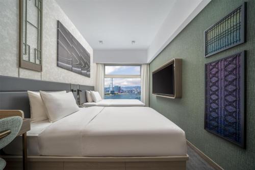 Motto by Hilton Hong Kong Sohoにあるテレビまたはエンターテインメントセンター