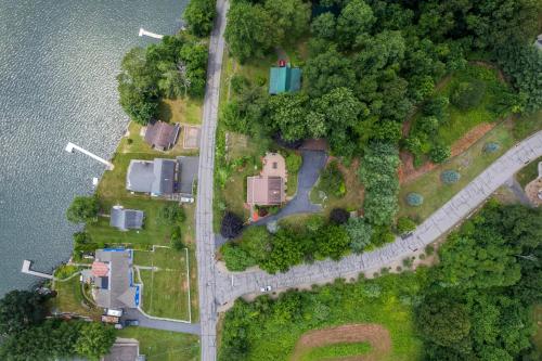 an aerial view of a house next to the water at Grammy's Famous Lake House Retreat in East Hampton