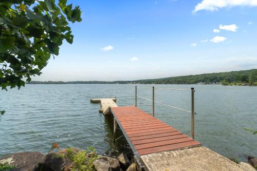 a dock on a large body of water at Grammy's Famous Lake House Retreat in East Hampton