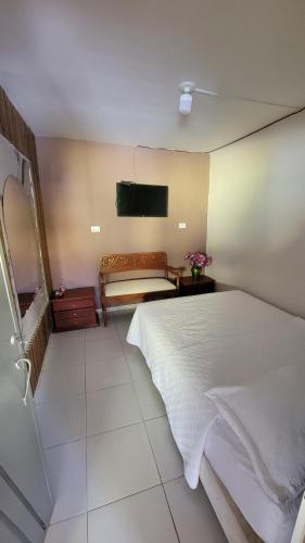Una cama o camas en una habitación de Hostal plaza valledupar