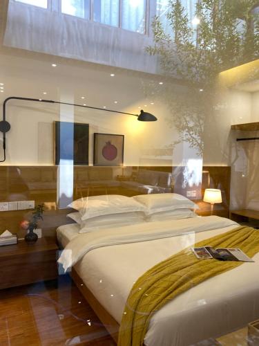 Ένα ή περισσότερα κρεβάτια σε δωμάτιο στο Liuxia Heshun Inn