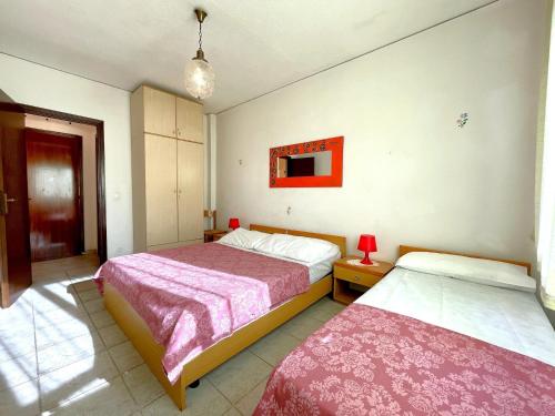 Ένα ή περισσότερα κρεβάτια σε δωμάτιο στο Apartment in Caorle near Beach and Pool