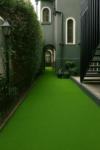 a green floor in a house with a hallway at De Blasis Budget Rooms in Santiago