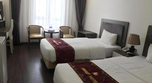 Katil atau katil-katil dalam bilik di Smart Hotel