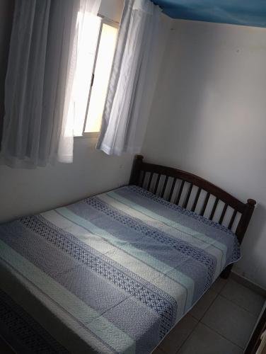 Katil atau katil-katil dalam bilik di Casa de temporada Aconchego Gravatá