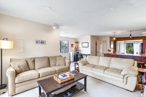 a living room with two couches and a table at Charming Cottage by Creek & Ocean in Blaine