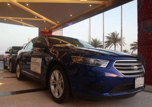 a blue car parked in a parking lot at Novotel Yanbu Albahr in Yanbu
