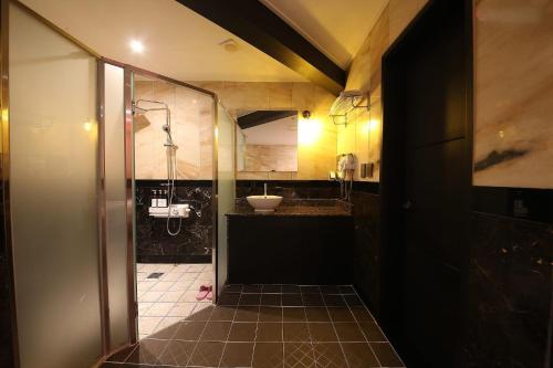 a bathroom with a sink and a toilet in it at Signature Tourist Hotel in Seoul