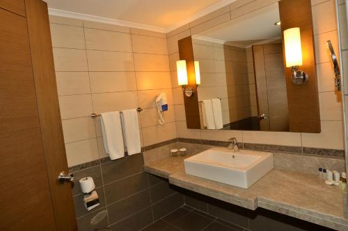 a bathroom with a sink and a mirror at Side Prenses Resort Hotel & Spa in Side