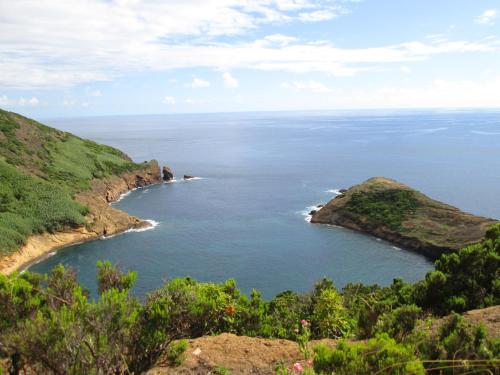 an island in the middle of a body of water at Residência Machado in Horta