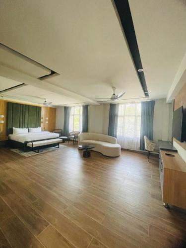 a large room with two beds and a couch at IFQ Premier Skardu in Skardu