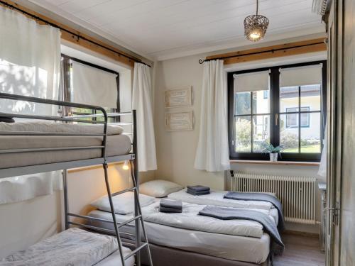 a room with two bunk beds and a window at Chalet in Leogang near Ski Lift & Bikepark in Leogang