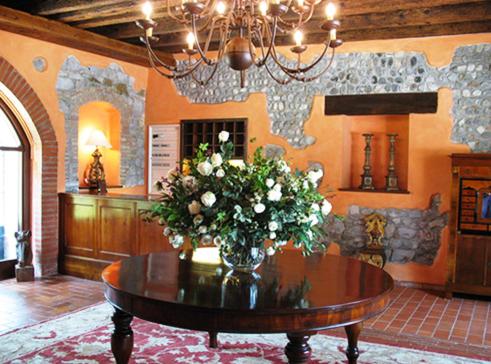 a vase of flowers on a table in a room at Villa Chiopris in Chiópris-Viscone