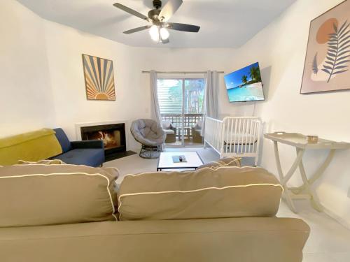 a living room with a couch and a fireplace at Bright and cozy 1-BR condo, WiFi in Wilmington
