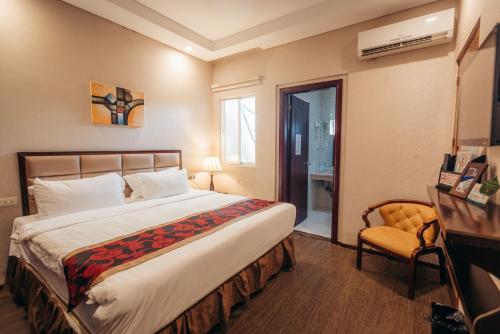 Postel nebo postele na pokoji v ubytování Palawan Uno Hotel