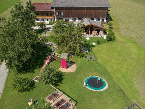 an aerial view of a backyard with a pool and a house at Alpen-Chalet-Pankraz in Fügenberg