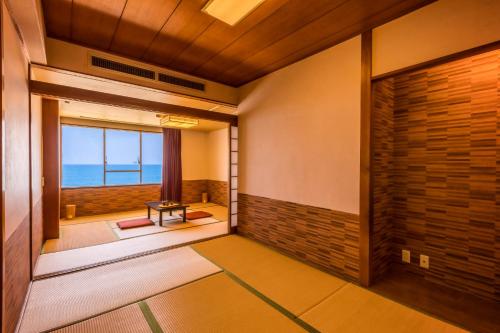 Postel nebo postele na pokoji v ubytování Ooedo Onsen Monogatari Kaike