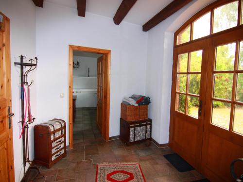 a hallway of a house with a door and a bathroom at Gutshaus in Gressow mit Teich in Gressow