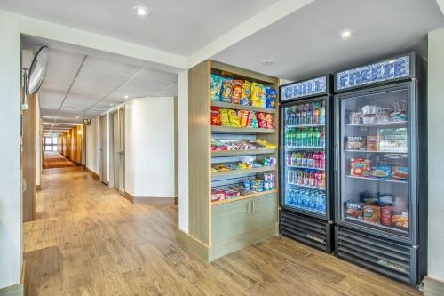 a hallway with an open refrigerator filled with food at Comfort Inn in Chatham