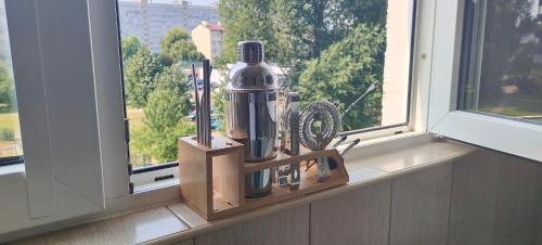 a window sill with a blender and other items on it at Sweet Home Inn in Świnoujście