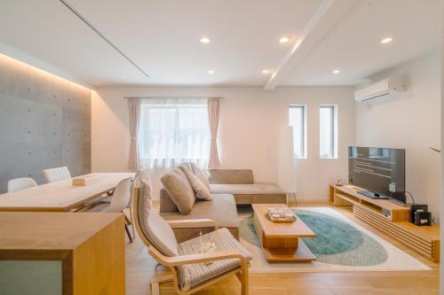 a living room with a couch and a table at 全新三之轮一户建b栋 in Tokyo