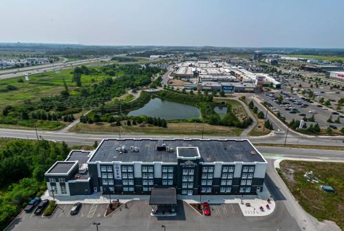an aerial view of a building with a parking lot at Microtel Inn & Suites by Wyndham Kanata Ottawa West in Kanata