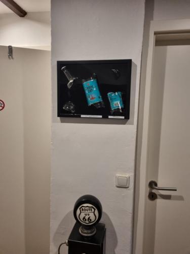 a room with a door with a clock on the wall at CJS Apartments - Chill or Drive am Nürburgring, Free Parking, WLan, Spacious Rooms, Quiet Location in Rodder