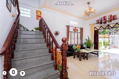 a living room with a staircase in a house at HM Villa Bãi Sau Lô Góc Nhiều tiện ích GIẢI TRÍ in Vung Tau