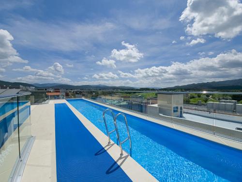 a swimming pool on the roof of a building at Hwangridan Stay in Gyeongju