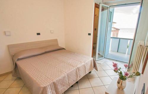 Ένα ή περισσότερα κρεβάτια σε δωμάτιο στο Residence Doral