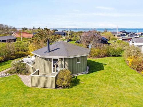 an aerial view of a small house in a yard at 4 person holiday home in Vinderup-By Traum in Vinderup