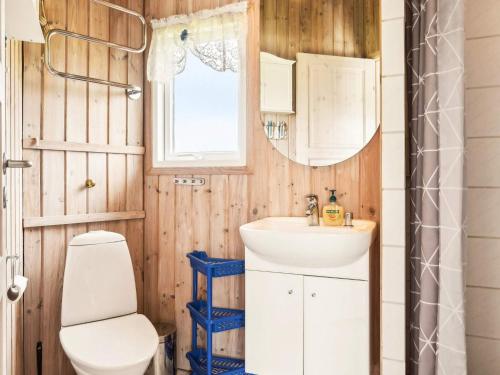 a bathroom with a toilet and a sink at 4 person holiday home in Vinderup-By Traum in Vinderup