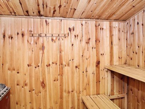 a wooden interior of a sauna with wooden walls at 10 person holiday home in Højslev-By Traum in Lund