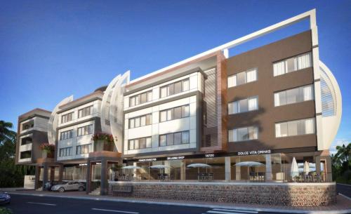a rendering of a building with a car parked in front at DUCASSI DELUXE playa LOS CORALES - rooftop pool and restaurants in Punta Cana