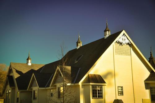 a church with a clock on the side of it at Hounds Tooth Inn in Oakhurst