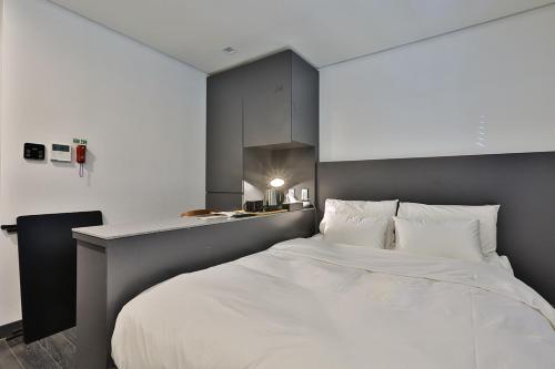 Postel nebo postele na pokoji v ubytování MAKERS x IPPDA HOTEL