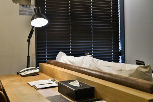 Postel nebo postele na pokoji v ubytování MAKERS x IPPDA HOTEL