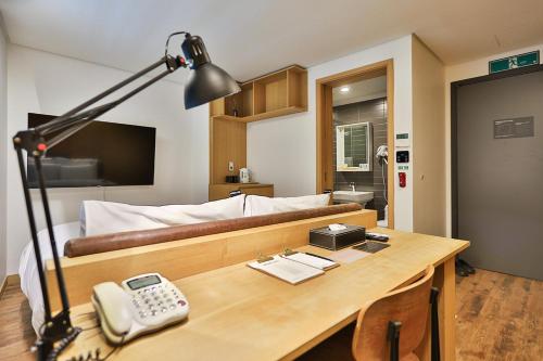 TV a/nebo společenská místnost v ubytování MAKERS x IPPDA HOTEL