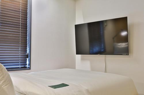 TV a/nebo společenská místnost v ubytování MAKERS x IPPDA HOTEL