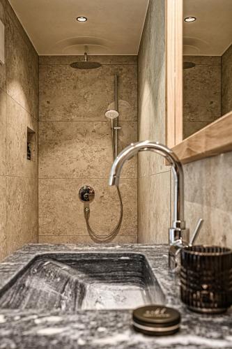 a bathroom with a sink and a shower at Naturhof eibl in Grossarl