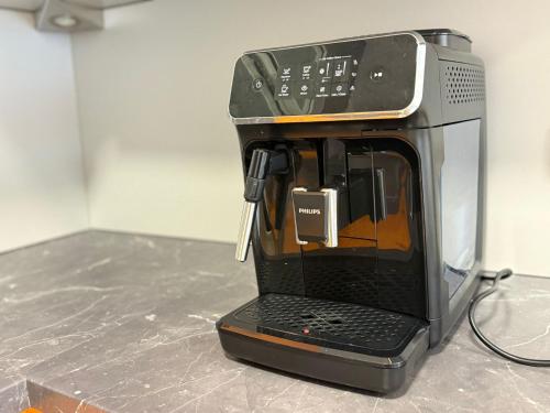 a coffee maker sitting on top of a counter at Victory Apartments in Leoben