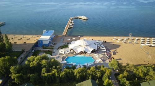 an aerial view of a beach with a tent and chairs at Villa Caprice 42 Issyk Kul in Bosteri