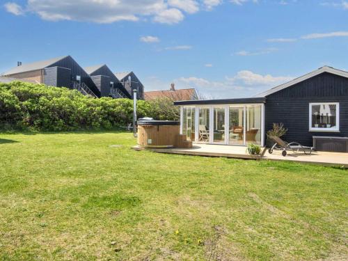 a house with a large yard in front of it at Luxury Spa Retreat in Thorsminde - By Traum Ferienwohnungen in Ulfborg