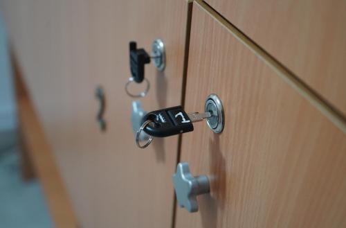 a close up of a wooden door with handles at Aquasalis in Câmpulung Moldovenesc