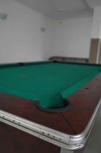a green ping pong ball on top of a table at Aquasalis in Câmpulung Moldovenesc
